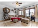 Spacious living room with sectional sofa, Christmas tree, and large windows at 438 E Palomino Way, San Tan Valley, AZ 85143