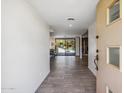 Bright entryway with tile floors and views of the backyard pool at 7255 N 12Th St, Phoenix, AZ 85020