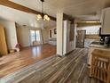 Open kitchen with stainless steel appliances and white cabinets at 8600 E Broadway Rd # 55, Mesa, AZ 85208