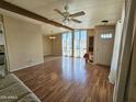 Living room features wood-look flooring and a ceiling fan at 8600 E Broadway Rd # 55, Mesa, AZ 85208