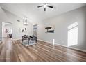 Bright dining room with hardwood floors and modern chandelier at 35920 W Cartegna Ln, Maricopa, AZ 85138