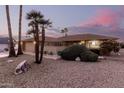 Single story home with attractive landscaping and a two-car garage at 21610 N Sunglow Dr, Sun City West, AZ 85375