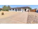 Newly renovated home with solar panels and a large driveway at 729 N 96Th Pl, Mesa, AZ 85207