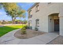 Condo building exterior featuring a walkway and landscaping at 15095 N Thompson Peak Pkwy # 1016, Scottsdale, AZ 85260