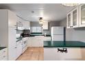 Efficient kitchen featuring white cabinets and green countertops at 701 S Dobson Rd # 421, Mesa, AZ 85202