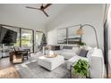 Spacious living room with sectional sofa and large windows at 7622 E Vista Dr, Scottsdale, AZ 85250