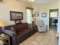 Cozy living room with a sofa and recliner at 7750 E Broadway Rd # 822, Mesa, AZ 85208