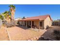 Backyard patio with seating area and gravel ground cover at 10096 N 63Rd Ave, Glendale, AZ 85302