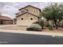 Two-story house with a landscaped yard, showcasing the side elevation at 22130 N Van Loo Dr, Maricopa, AZ 85138
