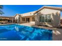 Stunning pool and patio area, perfect for entertaining at 44565 W Garden Ln, Maricopa, AZ 85139