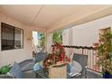 Covered patio with glass-top table and seating at 9355 N 91St St # 234, Scottsdale, AZ 85258