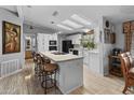 Open kitchen with island, granite countertops, and breakfast bar at 215 N Power Rd # 361, Mesa, AZ 85205