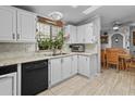 Bright kitchen with white cabinets, tile floors, and modern appliances at 215 N Power Rd # 361, Mesa, AZ 85205