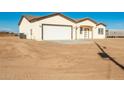 New construction home showcasing a clean, modern design and spacious yard at 35648 W Hidalgo Ave, Tonopah, AZ 85354