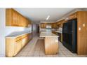 View of kitchen with island and appliances at 4141 W El Camino Dr, Phoenix, AZ 85051