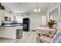 Well-equipped kitchen with white cabinets and modern appliances at 649 S Power Rd # 371, Mesa, AZ 85206