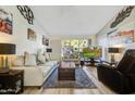 Bright living room featuring comfortable furniture and large windows at 649 S Power Rd # 371, Mesa, AZ 85206
