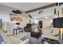Open living room with a view of the kitchen and access to other rooms at 649 S Power Rd # 371, Mesa, AZ 85206