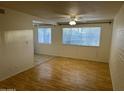 Bright living room with laminate floors and large windows at 8210 E Garfield St # K108, Scottsdale, AZ 85257