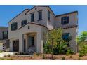 Two-story house with gray siding, brown garage door, and landscaping at 19743 W Exeter Blvd, Buckeye, AZ 85340
