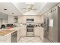 Spacious kitchen with stainless steel appliances and light wood cabinets at 4442 E Walatowa St, Phoenix, AZ 85044
