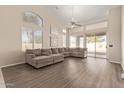 Bright living area with a large sectional sofa and sliding doors leading to the backyard at 1362 E Shannon St, Chandler, AZ 85225