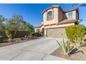 Two-story house with a large driveway and desert landscaping at 1864 W Buckhorn Trl, Phoenix, AZ 85085