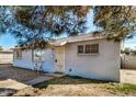 Single story home with a tree in front at 2917 W Diana Ave, Phoenix, AZ 85051