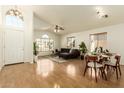 Open concept living and dining area with hardwood floors and modern furniture at 915 W Spur Ave, Gilbert, AZ 85233