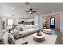 Open living room featuring comfortable seating and an inviting atmosphere at 943 N 97Th Way, Mesa, AZ 85207