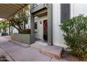 Condo building exterior showing entrance and landscaping at 2315 W Union Hills Dr # 116, Phoenix, AZ 85027