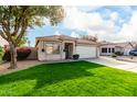 Attractive single-story residence with a manicured lawn and two-car garage at 3279 E Woodside Way, Gilbert, AZ 85297