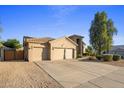 Two-story home with a two-car garage and desert landscaping at 4935 E Dale Ln, Cave Creek, AZ 85331