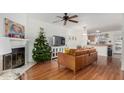 Living room with leather sofa, fireplace and Christmas tree at 5704 E Aire Libre Ave # 1210, Scottsdale, AZ 85254