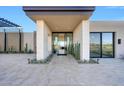 Elegant entryway with a modern design and glass doors at 9983 E Mirabel Club Dr, Scottsdale, AZ 85262