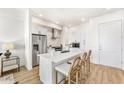 Contemporary kitchen featuring white cabinetry and a kitchen island at 3131 N Central Ave # 5017, Phoenix, AZ 85012