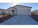 Newly constructed home with two-car garage and desert landscaping at 35595 W Mallorca Ave, Maricopa, AZ 85138