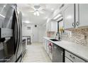 Sleek kitchen with stainless steel appliances and light gray cabinets at 4026 E Larkspur Dr, Phoenix, AZ 85032