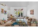 Bright living room with stained-glass window and comfortable seating at 10327 N 99Th N St, Scottsdale, AZ 85258