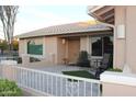 Small front patio with seating and artificial turf at 1522 Leisure World --, Mesa, AZ 85206