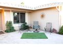 Inviting patio with seating area and artificial turf at 1522 Leisure World --, Mesa, AZ 85206