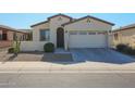 One-story home with two-car garage and desert landscaping at 17915 W Silver Fox Way, Goodyear, AZ 85338