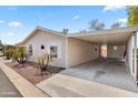 Covered carport with concrete flooring attached to the mobile home at 3330 E Main St # 111, Mesa, AZ 85213