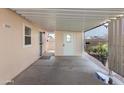 Covered patio with access to the home and backyard at 3330 E Main St # 111, Mesa, AZ 85213