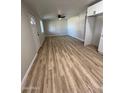 Large living room with new flooring and lots of natural light at 3937 W Cypress St, Phoenix, AZ 85009