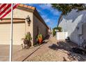 Sidewalk leading to the backyard with desert landscaping at 4106 E Mia Ln, Gilbert, AZ 85298