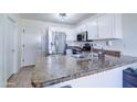 Kitchen boasts granite countertops and a double sink at 10856 E Arcadia Ave, Mesa, AZ 85208