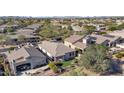 Aerial view of houses with solar panels and lush greenery at 22207 N 51St St, Phoenix, AZ 85054