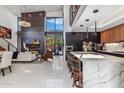 Open concept kitchen with marble island and modern appliances at 6525 E Cave Creek Rd # 9, Cave Creek, AZ 85331