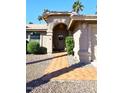 Front entryway with tiled walkway and arched entry door at 13854 N Fountain Hills Blvd, Fountain Hills, AZ 85268